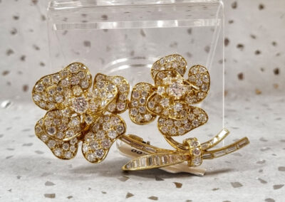 14kt yellow gold flower pin with 4 carats of diamonds